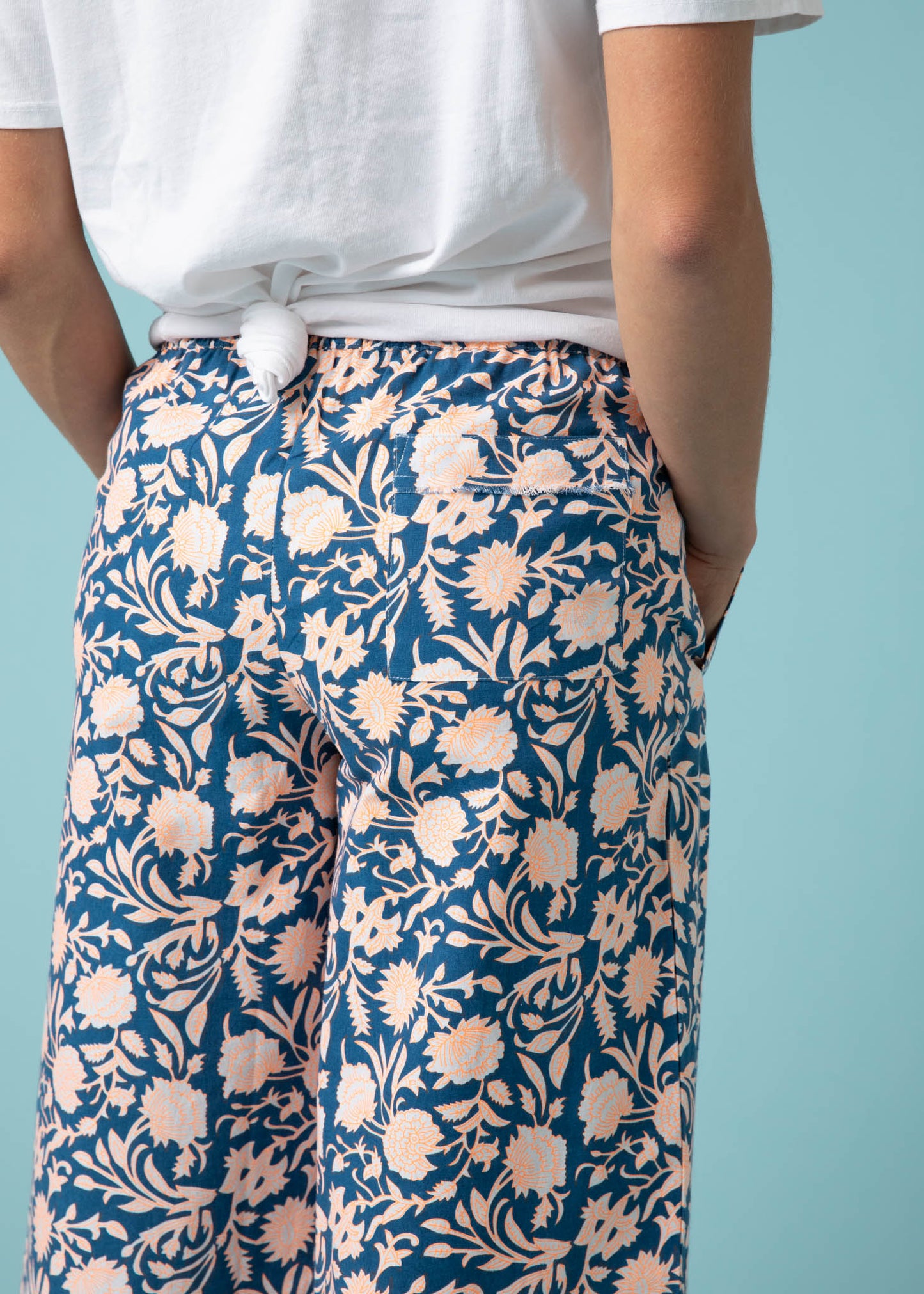 Shore Pant - Floral Escape in True Navy & Neon Peach 8 - Close up - Back